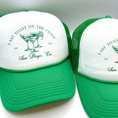 two green and white hats sitting next to each other