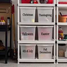 the shelves are filled with plastic containers labeled christmas, halloween, and fall decorations