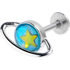 a blue and yellow star shaped ring with two silver balls on it's side