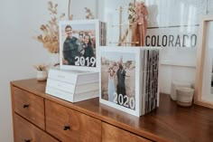 three photos on top of a wooden dresser