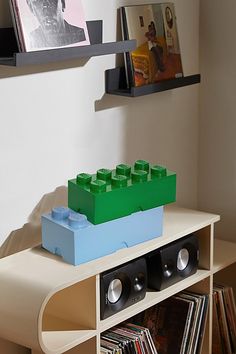 there is a shelf with legos on it in the living room and bookshelf