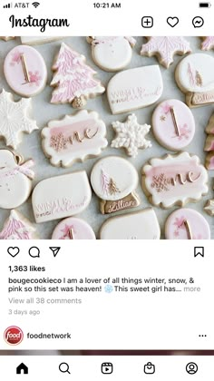 some cookies that have been decorated with pink icing and snowflakes on them