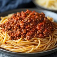 a plate of spaghetti with meat sauce on it