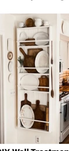 the kitchen is clean and ready to be used as a wall storage unit for dishes