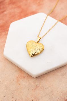 The Love Me Heart Heart Locket Necklace is the perfect way to show someone you care. Available in gold and silver, this cute necklace is a perfect gift for any occasion. Spread love and happiness with this adorable accessory. #lovemyleto #completeyourlook 100% Stainless Steel Imported