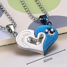 The Maya's Grace Two-Piece Stainless Steel Heart Necklace Set is a meaningful way to express your love. This couple's matching necklace features one silver half-heart puzzle pendant paired with a Blue, Silver, Gold, or Black half-heart pendant, both on a durable 20-inch silver-finish chain. Perfect as a gift for your significant other on anniversaries or special occasions, or wear both pieces together for a unique statement look. Jewelry Care: Store in a clean, dry place. Do not wear in water or Blue Necklace For Anniversary On Valentine's Day, Blue Heart Pendant Necklace For Mother's Day, Blue Double Heart Jewelry For Valentine's Day, Blue Jewelry For Valentine's Day Promise, Personalized Blue Heart Pendant Jewelry, Silver Stainless Steel Heart Necklace For Anniversary, Couples' Silver Stainless Steel Necklaces, Silver Stainless Steel Couples Necklace, Blue Double Heart Necklace For Gift