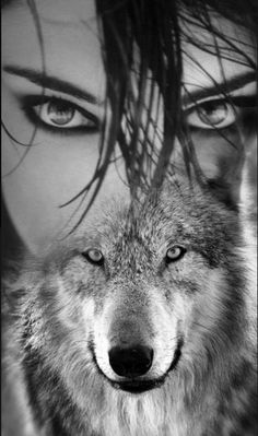 a woman with long hair standing next to a wolf's face in black and white