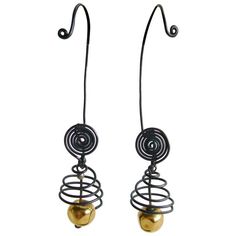 Hand made, one of a kind earrings designed and created by Margret Craver Withers of Kansas. Earrings are comprised of blackened, spiraling wire that create a cage for a golden kinetic bead. Earrings are quite clever in that they are designed for the woman who doesn't have pierced ears. The ear lobe is tucked behind the upper spiral while the long wire curves behind and around to the front of the ear. Earrings measure 3.75" overall, while the front piece measures about 2" from the top o Cartilage Piercing Hoop, Chalcedony Crystal, Cartilage Jewelry, Minimal Earrings, Geometric Studs, Ear Earrings, Mid Century Jewelry, Diy Wire Jewelry, Purple Crystals