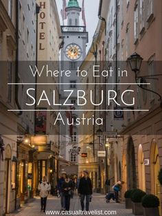 people walking down an alley way with the words where to eat in salzburg, austria