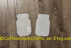 two pieces of cut out paper sitting on top of a wooden surface with the words coffee chick crafts on etsy com