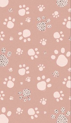 a pink background with white and black paw prints