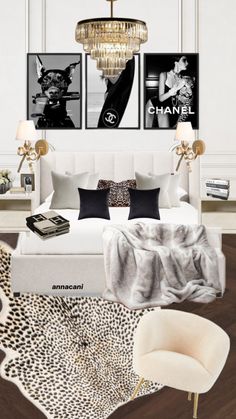 a bedroom with chandelier, leopard print rug and pictures on the wall above the bed