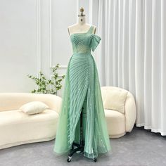 This one-shoulder evening dress radiates luxury and elegance with its sage green color and exquisite design. Perfect for weddings, formal events, and parties, this dress combines style and sophistication. Look and feel like royalty in the beautiful and unique luxury Dubai dress. window.adminAccountId=244214477; Green Evening Dress For Banquet During Prom Season, Green Off-shoulder Gown For Banquet, Green Off-shoulder Formal Gown, Green One-shoulder Gown For Gala, Green Strapless Evening Dress For Banquet, Green One-shoulder Gown With Fitted Bodice, Green Gown With Fitted Bodice For Banquet, Green Evening Dress With Asymmetrical Neckline, Green Off-shoulder Prom Gown