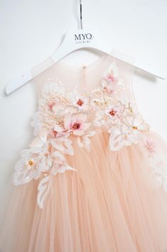 Cream Tulle Dresses With Floral Applique, Cream Tulle Dress With Floral Applique, Gold Embellished Ball Gown For Pageant, Gold Sleeveless Princess Dress For Spring, Sleeveless Gold Princess Dress For Spring, Pink Tulle Dress With Appliques, Pink Tulle Dresses With Appliques, Elegant Floral Applique Tutu Dress For Wedding, Elegant Wedding Tutu Dress With Floral Applique