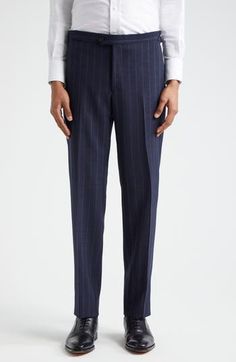 Pinstripes point up the precision tailoring of this structured suit cut from sumptuous wool in a single-breasted silhouette and framed with wide peaked lapels. Jacket has two-button closure; peaked lapels; four-button cuffs; chest welt pocket; front flap pockets; ticket pocket Trousers have zip fly with button-tab closure; front slant pockets; back button-welt pockets; adjustable waist Jacket is partially lined Trousers are unhemmed 100% wool Dry clean Made in Italy Designer Clothing Elegant Vertical Stripes Pants For Office, Elegant Striped Pants With Welt Pockets, Striped Wool Suit For Workwear, Striped Wool Suits For Work, Striped Wool Suits, Pinstripe Fitted Suit For Business Casual, Fitted Pinstripe Suits For Business Casual, Tailored Elegant Bottoms With Vertical Stripes, Elegant Tailored Bottoms With Vertical Stripes