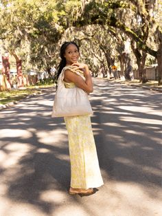 Our newest plush and versatile everyday Puffer Purse Tote in Shimmer Beige! A purse tote that can be worn well beyond the cozy season! This newest design was inspired by your requests for a larger purse and our Founder's vision of a purposeful and chic new shape to serve you right. It’s a Crossover bag you can carry through any weathering that life serves you. Use it for daytime business (fits a Macbook 15”) or for an evening soiree (need a backup pair of shoes?) Or, move from a fitness class to