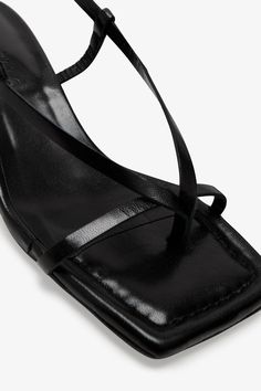 Strappy sophistication. Our Greta Sandals feature a modern square toe and an adjustable slingback strap for a flattering look, enhanced by a chic kitten heel and minimalist raw edges. Whether it's running between meetings or dancing the night away, their padded soles and soft Italian leather let you do it all in comfort—and impeccable style.[SPLIT] Astrid wears Greta in black, in cream, and in disco. Heel height is approximately 2" (5 cm). Sold in US sizes, though please note that shoes may be l Modern Square, The A Team, Slingback Sandal, Kitten Heel, Health Insurance, Black Sandals, Italian Leather, French Terry, Final Sale