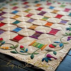 a close up of a quilt on a table