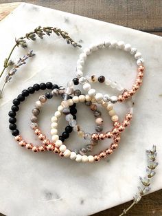 4 mm hematite rose gold beads with your choice of 4 mm stone beads.  If unsure on size measure your wrist and choose a size .5' larger than wrist size. Do not wear bracelets in water. To wear, roll onto wrist and don't stretch it out.  *FREE Shipping on orders over $35 (no coupon needed, USPS First Class Mail). Quick to ship! Rose Gold Stackable Stretch Bracelet With Round Beads, Rose Gold Stackable Bracelet With Round Beads, Adjustable Rose Gold Beaded Bracelets, Adjustable Rose Gold Beaded Bracelets With 8mm Beads, Stackable Round Beads Bracelets In Rose Gold, Hand-strung Rose Gold Beaded Bracelets For Everyday, Adjustable Rose Gold Spiritual Beaded Bracelets, Hand-strung Rose Gold Beaded Bracelets As Gift, Everyday Hand-strung Rose Gold Beaded Bracelet