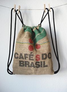 a bag hanging from a clothes line with the words cafe do brasil on it