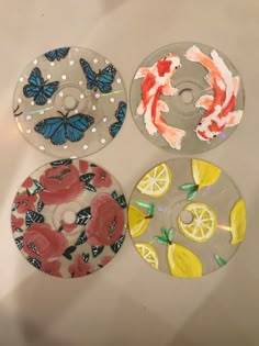 three glass plates with different designs on them