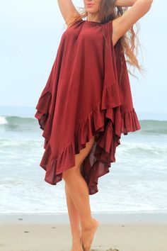 "Cover up in style in a simple and elegant cotton gauze beach poncho from Mademoiselle Mermaid!! ...It's a lovely, loose, and flowing kaftan dress with a scoop neck in front, a glamorously alluring low back, and a floaty handkerchief hem, edged with ruffles. Accessorize it with fantastic baubles collected on your travels, and add a pair of heels or wedges for a very fashion forward evening look at the resort!! ...Effortless to wear and available in a rainbow of colors!! Shown in \"Wine\". Fabric Mode Kimono, Afrikaanse Mode, African Maxi Dresses, Beachwear Fashion, Classy Dress Outfits, Latest African Fashion Dresses, Kaftan Dress, African Fashion Dresses, Beach Wear