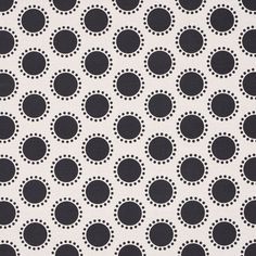 black and white polka dot fabric with circles on the front, in an allover pattern