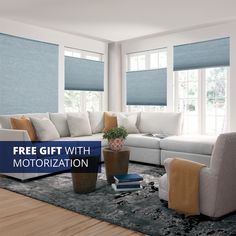 a living room filled with furniture and windows covered in blue roller shade blind shades on the windows