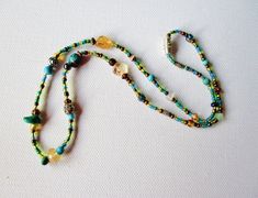 citrine turquoise seed bead artisan necklace 17.5 inches Adjustable Pendant Jewelry For Festivals, Adjustable Pendant Jewelry For Festival, Adjustable Long Festival Necklace, Artisan Jewelry With Colorful Adjustable Beads, Adjustable Crystal Necklaces With Gemstone Beads, Artisan Adjustable Colorful Beaded Jewelry, Adjustable Round Beads Jewelry For Gifts, Adjustable Beaded Lariat Jewelry, Adjustable Gold Jewelry With Colorful Beads