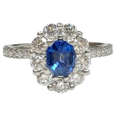 an oval blue and white diamond ring