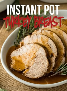 sliced pork roast with gravy in a white bowl