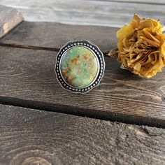 "This Kingman Turquoise stone has such an earthy vibe, perfect for fall. It's set in a silver beaded border which has been oxidized to show off the details and it has a simple, slightly hammered sterling silver shank in a size 8.5-8.75. The face measures 1.1\" Ring Size 8.5-8.75 Turquoise is known as the master healing stone. Attributed to the power of connecting mind, body, and soul, it is also a symbol of superior energies and spiritual openness What do you receive when you purchase from Crims Bohemian Turquoise Gemstone Ring, Bohemian Green Turquoise Gemstone Ring, Bohemian Chrysoprase Turquoise Ring, Bohemian Turquoise Chrysoprase Ring, Artisan Green Turquoise Ring One Of A Kind, Bohemian Turquoise Ring With Natural Chrysocolla, Bohemian Turquoise Ring With Chrysocolla, Bohemian Turquoise Chrysocolla Ring With Natural Stones, Bohemian Untreated Green Turquoise Ring