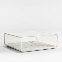 a glass and marble coffee table on white background