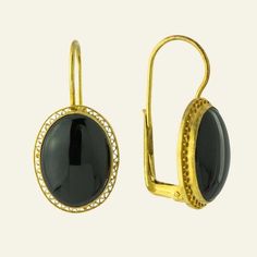 Sensual minimalism. This bold Victorian design features a black onyx stone in a classic 24k vermeil gold open work setting. European backs for pierced ears. Size: 1 1/4 inch. Black Gold-plated Earrings For Formal Occasions, Formal Black Gold-plated Earrings, Gold Onyx Jewelry With Black Enamel, Classic Black Enamel Jewelry For Evening, Classic Gold Onyx Jewelry, Modern Gold Cabochon Earrings, Classic Evening Jewelry With Black Enamel, Gold Onyx Earrings For Evening, Elegant Black Oval Earrings