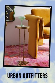 an advertisement for urban outfitters featuring a chair and table with a glass on it