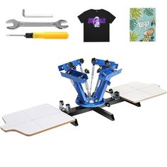 a t - shirt and tools sitting on top of a table