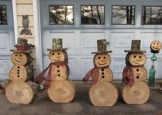 four snowmen are standing in front of a garage door with the words diy project ideas using wood wedges or logs