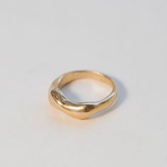 Organically carved to mimic the ebb and flow of coastal tides. Details: Original design carved in wax and cast in sterling silver. Gold ring is vermeil. Rings sold individually, but they stack well together.