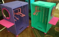 two cardboard boxes with pink and green handles, one is shaped like a shoe rack