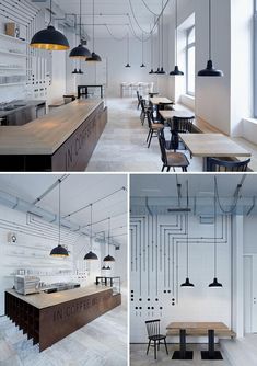 the interior of a restaurant with wooden tables and black pendant lights hanging from the ceiling