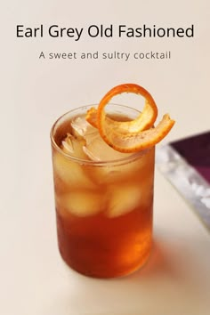 an old fashioned drink with orange slices on the rim