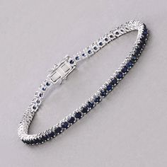 14k Gold Blue Sapphire Bracelet, Genuine Blue Sapphire Rounds Gold Bracelet for Women, Blue Sapphire Gold Tennis Bracelet, Gift for Her Dazzle in the deep blue allure of this 14K white gold tennis bracelet, featuring 6.38 carats of genuine round blue sapphires. Each sapphire is meticulously set to create a seamless line of vibrant color, perfect for adding a touch of luxury to any ensemble. The bracelet's classic design is enhanced by its secure box clasp, ensuring both elegance and peace of min Sapphire Tennis Bracelet Fine Jewelry With Prong Setting, Classic Blue Bracelet Jewelry, Sapphire Tennis Bracelet With Jubilee Design, White Gold Sapphire Bracelet As Gift, Blue Sapphire Diamond Round Bracelet, Elegant Blue Sterling Silver Bracelet As Gift, Elegant Blue Sterling Silver Bracelet For Gift, Classic Blue Sterling Silver Bracelets, Classic Blue Sterling Silver Bracelet