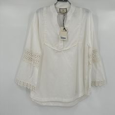 Tuckernuck | Tnuck Beach Piper Lace Top Color: Blanc Size: Medium Retail: $128 Condition: New With Tags 22.5" Pit-To-Pit 27" Long -Band Collar -V-Neckline -Long Sleeves -Eyelet Detailing On Elbows -Lace Detailing On Bib -Loose Fit -90% Cotton, 10% Linen -Machine Wash Cold. Gentle Cycle. Wash Separately. Do Not Bleach. Line Dry. Warm Iron. White Summer Blouse For Beach Season, White Linen Top For Vacation, White Summer Blouse For Vacation, White Summer Linen Blouse, White Linen Summer Blouse, White Cotton Blouse For Beach Season, White Linen Top For Beach Season, White Cotton Blouse For Vacation, Band Collar