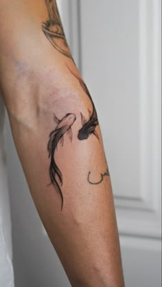 a person with a tattoo on their arm