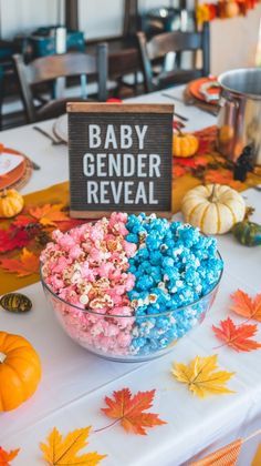 a bowl filled with candy sitting on top of a table