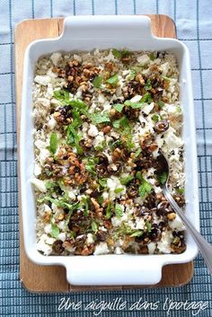 a casserole dish filled with rice and vegetables