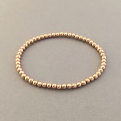 "14k gold fill, rose gold fill, or sterling silver balls are strung onto a stretchy elastic cord. Balls measure 3 mm (approximately 1/8 of an inch). Available as a single bracelet or a set of 3. Great piece to layer! 4mm ball bracelet is here: https://www.etsy.com/listing/694393921/4mm-beaded-ball-bracelet-in-gold-fill 5mm ball bracelet is here: https://www.etsy.com/listing/694396085/5mm-beaded-ball-bracelet-in-gold-fill YOUR ORDER - Choose the number of bracelets you want in the drop-down menu,