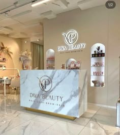 the inside of a beauty store with marble counter tops