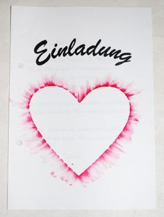 a piece of paper with a heart drawn on it and the word embalng written in black ink