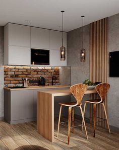 a kitchen with two chairs and a table in front of a tv on the wall